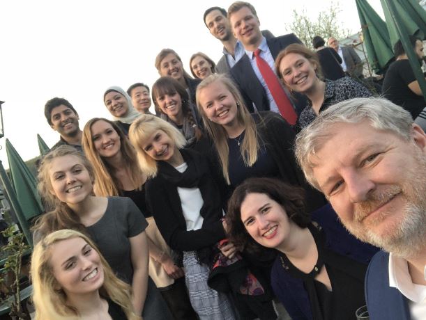 Students and faculty smile while in Austria