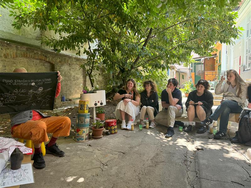 Students watching an art demonstration